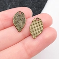 Antique bronze leaf charm with intricate vein textures for DIY jewelry and crafts - Antique Leaf (11327)