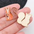 Detailed macro of squirrel enamel charms for DIY jewelry showing front and back textures - Squirrel With Pinecone (19340)