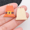 Macro view of pilgrim hat charms showing orange enamel front and textured gold back - Magic Hat (19339)