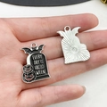 Macro detail of Halloween tombstone pendant with bat and pumpkin motifs in zinc alloy - Enamel Pumpkin Bat Tombstone Pendant (19374)