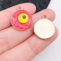 Detail of round enamel eyeball pendant with red and yellow design for DIY jewelry - Red