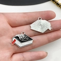 Close-up of gothic alloy enamel magic book charms with bone hand and star patterns - Enamel Pentagram Magic Book Pendant (19372)