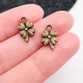 Antique bronze four-leaf clover alloy pendant with detailed textures for DIY jewelry - Clover (20485)