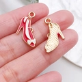 Macro detail of high heel shoe alloy charms with red enamel and golden polka dots - Red Bow High Heels