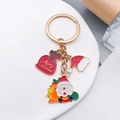 Golden Christmas keychain featuring Santa Claus, Merry Christmas bag and hat charms - Santa Claus Hat Gift Bag Style (ER817)