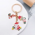 Christmas keychain with Santa Claus, candy cane, and stocking charms in gold finish - Stocking Candy Santa Claus Style (ER816)