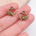 Antique bronze heart pendants with wings and hanging loops for DIY jewelry making - Intertwined Wing Heart Charm (19950)