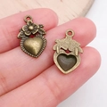 Antique bronze heart pendants with floral details and textured vintage finish - Floral Leaf Decorative Heart Charm (19952)