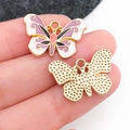 Pendentifs papillons en émail coloré avec bords dorés pour la création de bijoux DIY - Aile de Papillon en Émail Violet et Blanc (19089)