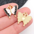 Enamel butterfly charm showing black white front and golden textured back for jewelry DIY - Black and White Enamel Butterfly Wing (19096)