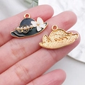 Black enamel hat charm with white flower and pearl accent in gold-plated alloy - Black Pearl Bow Hat