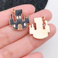 Black enamel castle pendant for DIY jewelry making shown in hand for size scale - Castle Style (19521) / Black