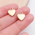 Handheld view of two small gold heart charms for DIY jewelry and necklace making - Heart Shape (19973)