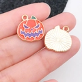 Halloween pumpkin charm with orange enamel and purple facial details for DIY jewelry - Orange