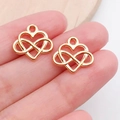 Golden heart and infinity charm on fingertip showing small size for DIY jewelry - Heart Shape (19985)