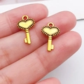 Detail of vintage heart-shaped alloy key charms in antique gold finish for DIY jewelry - Antique Gold Heart Key (11091)