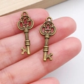 Two antique bronze heart-shaped key pendants for DIY jewelry making accessories - Vintage Hollow Small Key (1611) / Antique Bronze