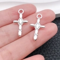 Pair of bright silver cross pendants made of alloy for DIY necklace making - Oval Spliced Cross Style (20354)