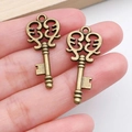 Pair of antique bronze skeleton key pendants with vintage hollow carvings for DIY jewelry - Fine Pattern Vintage Key (20986) / Antique Bronze