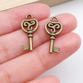 Vintage bronze heart-shaped key pendants with triskele pattern for DIY jewelry - Triskele Pattern Heart Key (20987) / Antique Bronze
