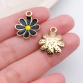 Detail of black and yellow enamel daisy pendant with golden textured back and jump ring - Black Enamel Alloy Daisy Flower (18788)