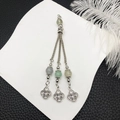 Detail of vintage silver tassel pendant with colorful beads and Celtic knot charms - White Beads Antique Silver Tassel (21110)