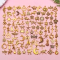 Mix of 70+ golden alloy charms with animal, ocean, and sun designs for DIY jewelry - Antique Gold Mixed (SN1015)
