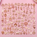 Collection of rose gold alloy charms including musical instruments and floral patterns - KC Gold Mixed (SN1019)