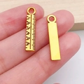 Antique gold finish ruler pendant charm featuring detailed measurement scale engraving - Miniature Graduated Ruler (20240)