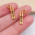 Set of two gold vintage clothespin pendants with Love engraving for DIY jewelry making - Vintage Tool Clip (20241)