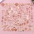 Mix of antique gold alloy charms featuring sewing tools and religious cross pendants - KC Gold Mixed (SN1024)