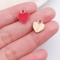 Pink enamel heart and golden textured heart DIY necklace charms shown on fingertips - Red Heart Shape Style (11027)