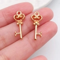 Delicate golden heart-shaped key pendant with a bow detail for DIY jewelry making - Heart Pattern Hollow Key (18270)