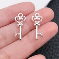 Polished silver heart-shaped wing key pendant with hollow patterned bow details - Bright Silver Hollow Heart Key (20957)