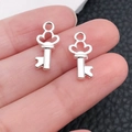 Pair of silver heart-shaped key pendants for DIY necklaces and jewelry making - Bright Silver Mini Heart Key (20961)
