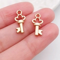 Paar gouden klavervormige sleutelhangers voor het maken van DIY kettingen en armbanden - Mini Hart Sleutel (20995)