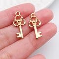 Gouden bloemsleutel hangers van legering voor DIY kettingen en oorbellen accessoires - Driebladige Bloemsleutel (20998)