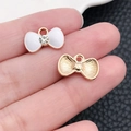 DIY bowknot pendant charm in white enamel with a sparkling rhinestone center - White Enamel Bowknot Charm with Rhinestone (10997)