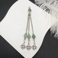 Vintage silver tassel pendant with translucent green beads and Celtic knot charms - Light Green Beads Antique Silver Tassel (21113)