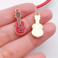 Miniature red and gold guitar pendant charm for DIY jewelry making in a vibrant enamel finish - Music Guitar (19466)