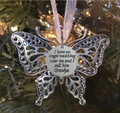 Close-up of angel wing butterfly memorial pendant with Grandpa engraving on Christmas tree - Grandpa