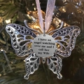 Silver butterfly ornament with Wife memorial text hanging on Christmas tree branch - Wife