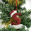 Sparkling red glitter letter S Christmas ornament with Santa hat on pine tree branch - Letter S (Style S)