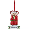 Resin couple Christmas ornament with glitter hats and polar bear slippers hanging by red ribbon - 2 Members