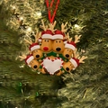 Detailed view of resin reindeer family ornament hanging on a Christmas tree branch - 6 Heads Reindeer Family