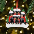 Close-up of black bear family resin Christmas ornament with glitter trees and red scarf - 6-Bear Style