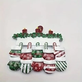 Christmas resin hanging ornament with fireplace design, red candles and four snow mittens - Snowflake Mitten Family Style (5598143997282)