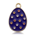 Detail of egg-shaped blue enamel pendant with colorful dots and golden metal ring - Red Polka Dot Egg
