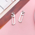 Pair of vintage silver alloy mini saw charms with realistic tooth and frame details - Antique Silver Saw (8525)