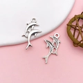 Antique silver dolphin pendants for DIY jewelry with detailed front and mesh textured back - Antique Silver Alloy Double Dolphin Leap Style (10379)